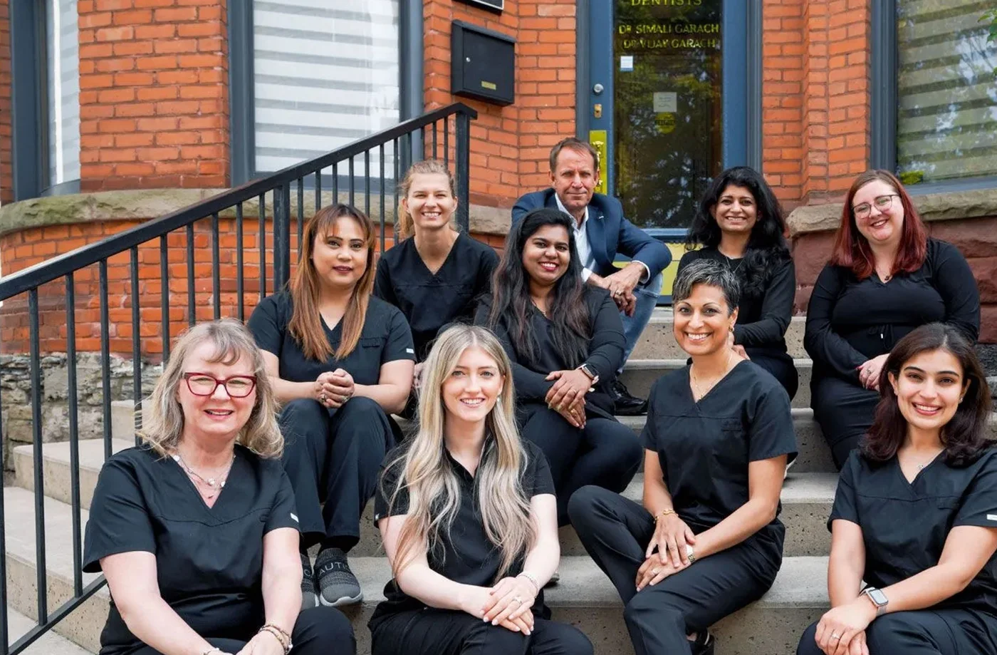 The Queen King Dental team in front of the Hamilton office